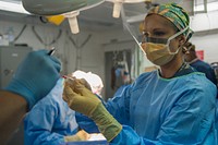 MEDITERRANEAN SEA (July 11, 2017) Hospital Corpsman 1st Class Christina Sizemore prepares anesthesia during surgery aboard the aircraft carrier USS George H.W. Bush (CVN 77).