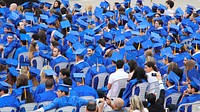 Graduating students in mortarboards. Free public domain CC0 photo.