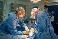 MEDITERRANEAN SEA (July 11, 2017) Hospital Corpsman 1st Class Christina Sizemore, left, and Ships Surgeon Lt. Cmdr. Krista Puttler perform a surgical operation aboard the aircraft carrier USS George H.W. Bush (CVN 77).