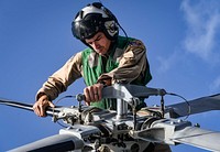 MEDITERRANEAN SEA (Aug. 17, 2017) Naval Aircrewman (Helicopter) 2nd Class Jacob Finerfrock, from the &acirc;Grandmasters&acirc; of Helicopter Maritime Strike Squadron (HSM) 46, Det. 1, prepares an MH-60R Seahawk helicopter for flight operations on the flight deck of the Arleigh Burke-class guided-missile destroyer USS Oscar Austin (DDG 79), Aug. 17, 2017.