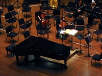 Closeup of warming up performers in Benaroya Hall. Free public domain CC0 photo.