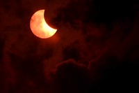 Partial solar eclipse on black background. Original public domain image from Flickr