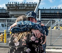 NAVAL STATION MAYPORT, Florida (Aug. 19, 2017) Master-at-Arms 3rd Class Taylor Rayon greets her mother, Kristi Rayon, pierside before they join the Tiger Cruise aboard the aircraft carrier USS George H. W. Bush (CVN 77).
