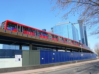 A southbound London Docklands Light Railway train headed by B07 unit No.133 approaches Crossharbour station.