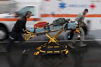 Emergency responders from the 374th Medical Group transport a simulated victim during an active shooter exercise, Aug. 16, 2017, at Yokota Air Base, Japan.