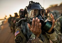 U.S. Army Command Sgt. Maj. Shelita Taylor, the command sergeant major of the 400th Military Police Battalion, U.S. Army Reserve, dons and clears her gas mask during a team-building ruck march held by the 200th Military Police Command during a 'CSM Huddle' in Scottsdale, Arizona, Sept. 16, 2017.