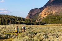 Hikers on Swan Lake Flat by Jacob W. Frank. Original public domain image from Flickr