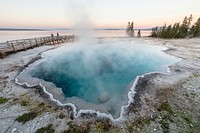 Family enjoying a sunset near Black Pool in West Thumb Geyser Basin. Original public domain image from Flickr