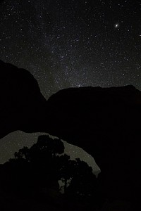 The Andromeda Galaxy tangos with Broken Arch on a crisp fall night. Original public domain image from Flickr