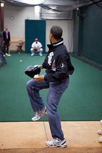 President Barack Obama warms up with St. Louis Cardinals first baseman Albert Pujols before the start of the MLB All-Star Game in St. Louis, July 14, 2009.