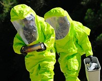 U.S. Air Force explosive ordnance disposal technicians carry munitions during a mass casualty exercise at Hurlburt Field, Fla., July 20, 2009.