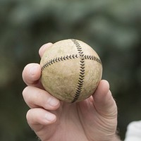 A baseball used during a historic baseball game, where players wear uniforms of the period and follow the baseball rules of the time, is in play at the 1900 era village at the Iowa Living History Farms in Urbandale, IA, on Aug. 5, 2017.