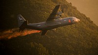 A U.S. Air National Guard C-130J equipped with the MAFFS 2 (Modular Airborne Fire Fighting System) drops a line of Phos-Chek on the Thomas Fire in the hills above the city of Santa Barbara Dec. 13, 2017.