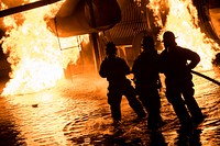 U.S. Air Force and civilian firefighters put out a blaze during nighttime live-fire training, Nov. 9, 2017, at Moody Air Force Base, Georgia.