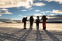 Backcountry campers watch the sunset in Lower Geyser Basin from the road by Jacob W. Frank. Original public domain image from Flickr