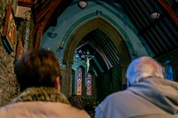 Christians praying in a church during Advent. Original public domain image from Flickr