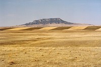 Square Butte in Judith Basin Co., MT. April 2004. The soils in the foreground are Danvers clay loam; in the middle ground the soils are Danvers-Judith clay loams. Original public domain image from Flickr