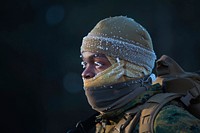 U.S. Marine Corps Lance Cpl. Kwan Walker, a networking administrator assigned to Marine Wing Communication Squadron 28, braces the cold during a conditioning hike during exercise Ullr Shield on Fort McCoy, Wis., Jan. 13, 2018.