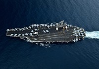 180401-N-XC372-1135 STRAIT OF MALACCA (April 1, 2018) U.S. Navy Chief Petty Officers assigned to Commander, Carrier Strike Group 9; Carrier Air Wing 17; Commander, Destroyer Squadron 23; and USS Theodore Roosevelt (CVN 71) stand in formation on the flight deck of the Roosevelt in the Strait of Malacca April 1, 2018, for a photo honoring the 125th birthday of the Navy Chief Petty Officer rate.