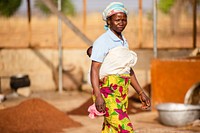 USAID in Ghana: Shea Butter Processing.USAID and the Global Shea Alliance partner to connect West Africa village women to the global marketplace. Photo: Douglas Gritzmacher/USAID. Original public domain image from Flickr