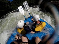 Patrons hit the rapids while whitewater rafting through the Ocoee River in the Cherokee National Forest, TN. (USDA Photo by Lance Cheung). Original public domain image from Flickr