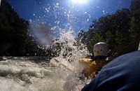 Patrons hit the rapids while whitewater rafting through the Ocoee River in the Cherokee National Forest, TN. (USDA Photo by Lance Cheung). Original public domain image from Flickr