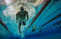 U.S. service members and veterans compete in the 100-meter freestyle swimming event in the 5th Annual Air Force Wounded Warrior Trials at the University of Nevada Las Vegas pool Feb. 25, 2018.