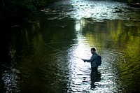 Tyler Hunt goes fly fishing in the Davidson Campground, Pisgah National Forest, NC. (Forest Service photo by Cecilio Ricardo). Original public domain image from Flickr