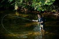 Aaron Baker, Tyler Hunt, and Courtney Hunt go fly fishing in the Davidson Campground, Pisgah National Forest, NC. (Forest Service photo by Cecilio Ricardo). Original public domain image from Flickr