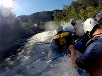 Patrons hit the rapids while whitewater rafting through the Ocoee River in the Cherokee National Forest, TN. (USDA Photo by Lance Cheung). Original public domain image from Flickr