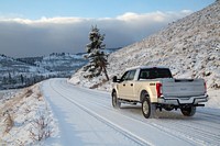 Snow-covered road near Tower Junction by Neal Herbert. Original public domain image from Flickr