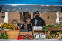 Green Bexar Farm (deep blue canopy) at the Pearl Farmers Market in San Antonio, Texas, on Oct 21, 2020.