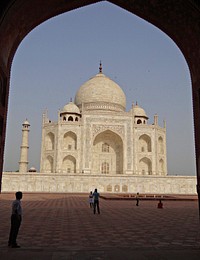 Taj Mahal through arched door. Free public domain CC0 photo.