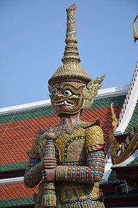 Giant statue in temple of the emerald background. Free public domain CC0 photo.