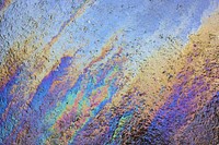 Colorful oil on ground texture. Free public domain CC0 photo.