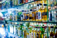 Bar counter with bottles. Free public domain CC0 photo.