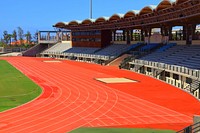 Empty running track and field during daytime. Free public domain CC0 photo.