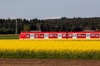 Train travelling on a track. Free public domain CC0 photo.