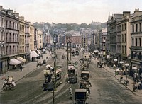 Vehicles and pedestrians on city road. Free public domain CC0 photo.