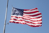 American flag waving against sky. Free public domain CC0 photo.