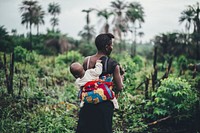 African woman carrying child - unknown date & location