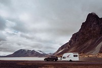 Free car and caravan on scenic road image, public domain CC0 photo.