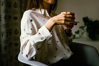 Free women with white shirt sitting in the room image, public domain people CC0 photo.