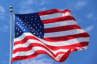 American flag waving against sky. Free public domain CC0 photo.