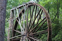 Alloy wheel, wooden machine. Free public domain CC0 image.