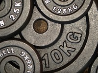 Closeup on gym weight plates. Free public domain CC0 image.