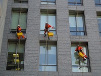 Window cleaners on building. Free public domain CC0 photo.