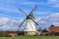 Rustic windmill building in the countryside. Free public domain CC0 image.