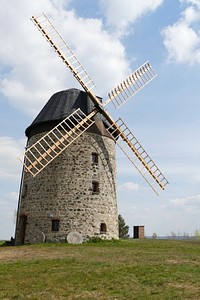 Rustic windmill building in the countryside. Free public domain CC0 image.