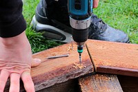 Carpenter drilling, close up. Free public domain CC0 photo.